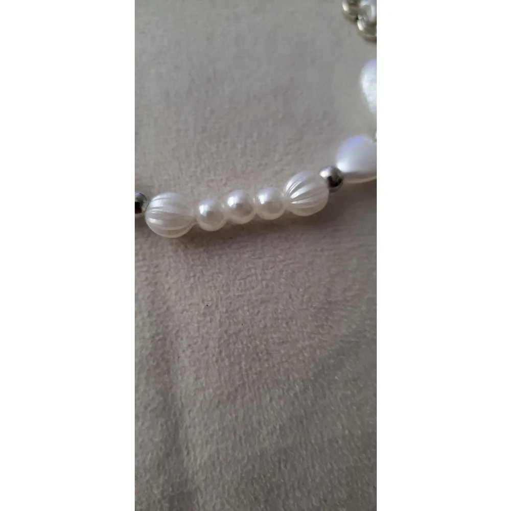 Phone chain with a variety of white & silver-tone beads, including faux pearls